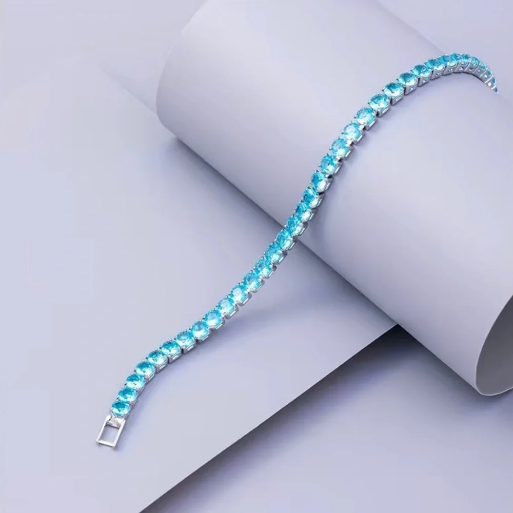 Beautiful Round Blue Topaz Bracelet In White Gold - Picture 1 of 12